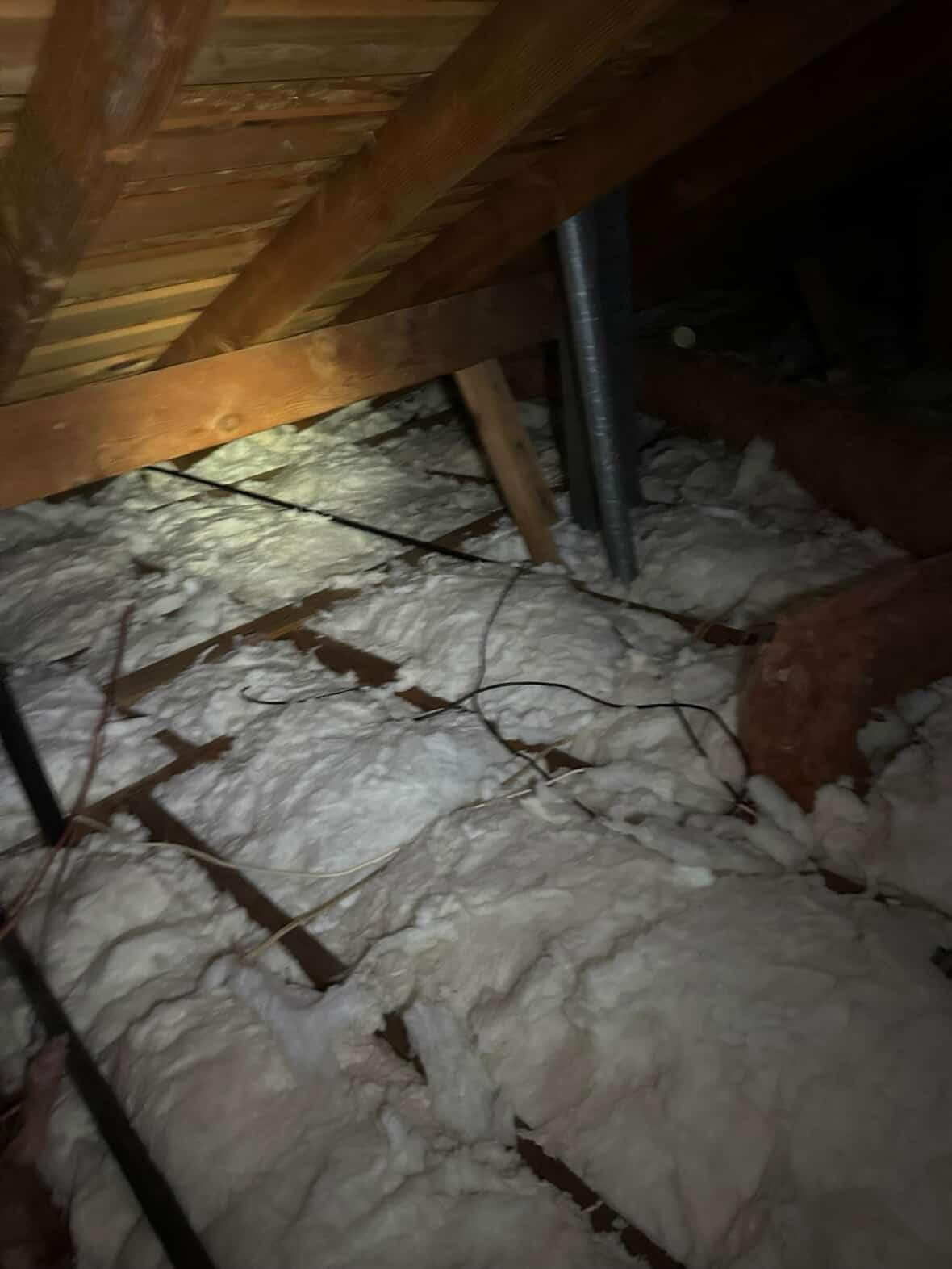 fresh insulation installed into an attic of a home